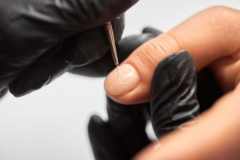 professional-manicurist-hands-painting-elegant-abs-2023-11-27-05-34-52-utc